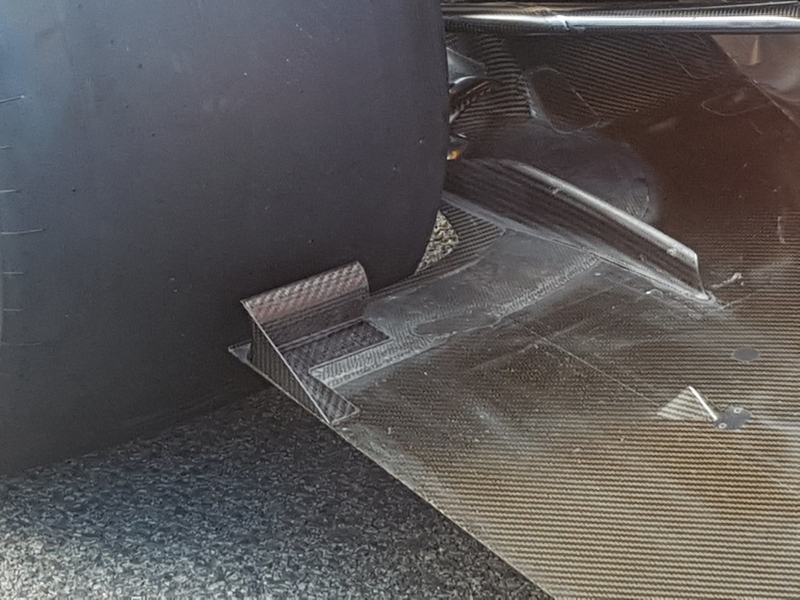 “No slots in the Mac floor edge, but there is this device in front of the tyre #F1" @ScarbsTech
